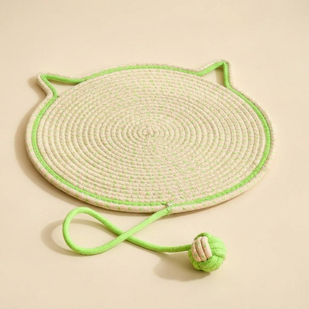Braided Rope Cat Scratch Mat in green with play ball, studio shot