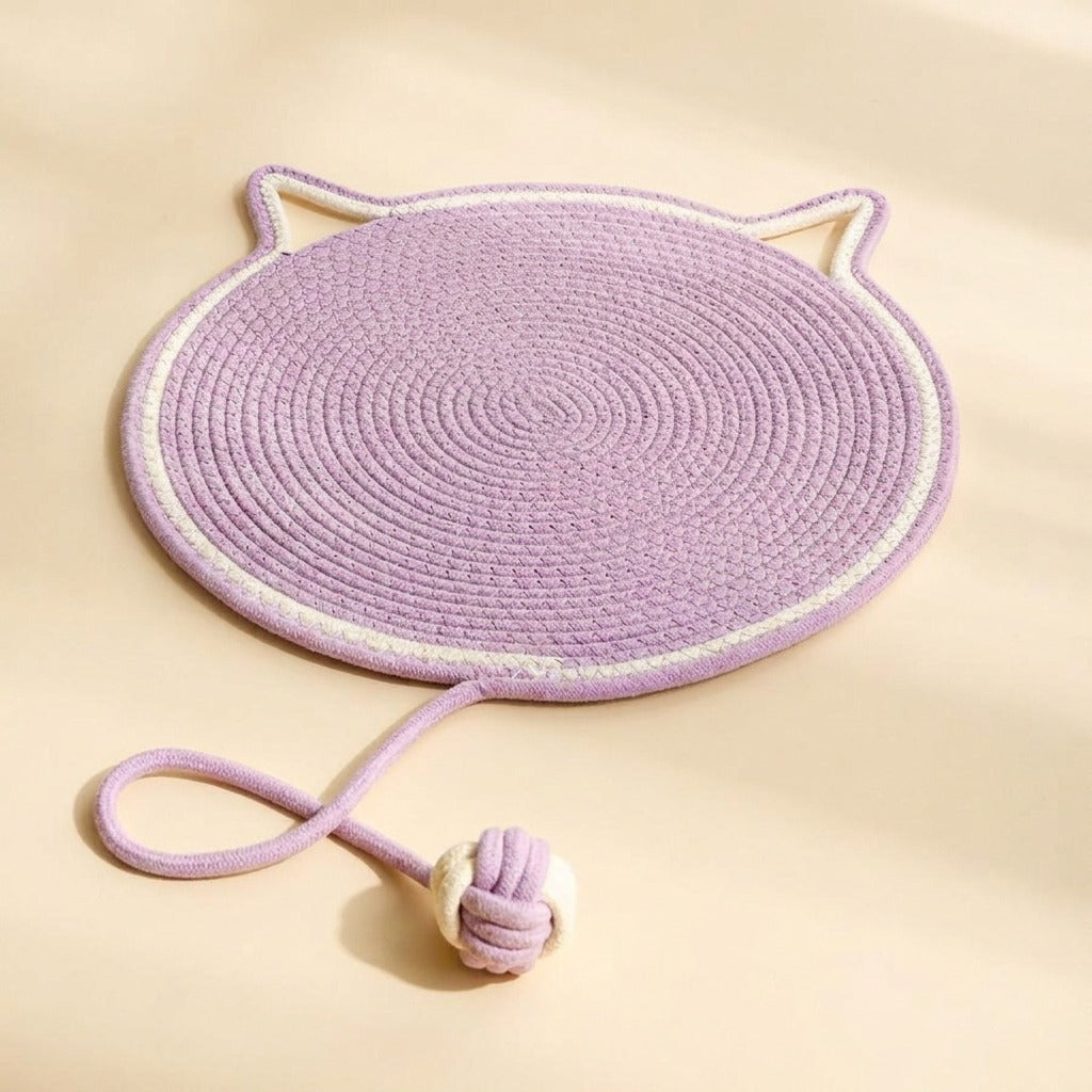 Braided Rope Cat Scratch Mat in pink with play ball, studio shot