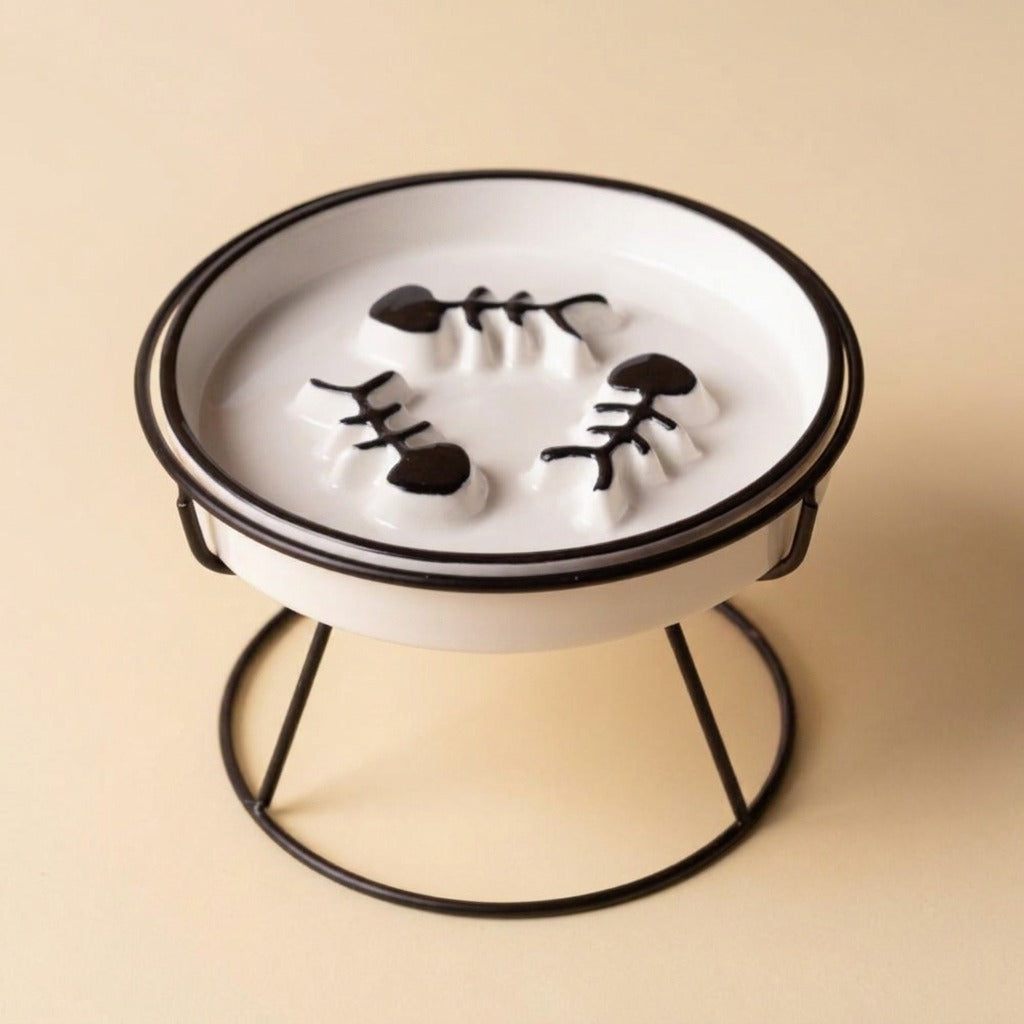 Flat Face Slow Feed Dish, black plate on black stand, studio shot