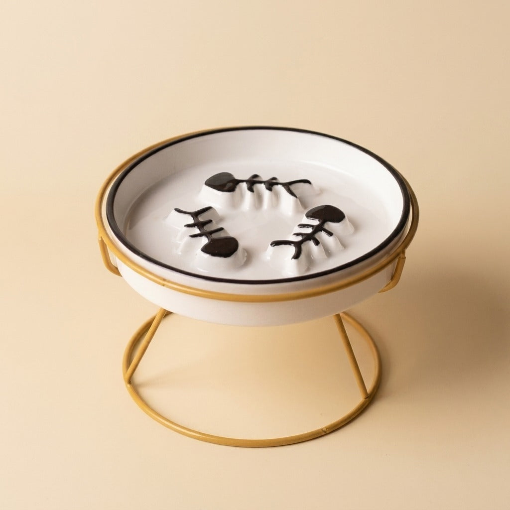 Flat Face Slow Feed Dish, black plate on gold stand, studio shot