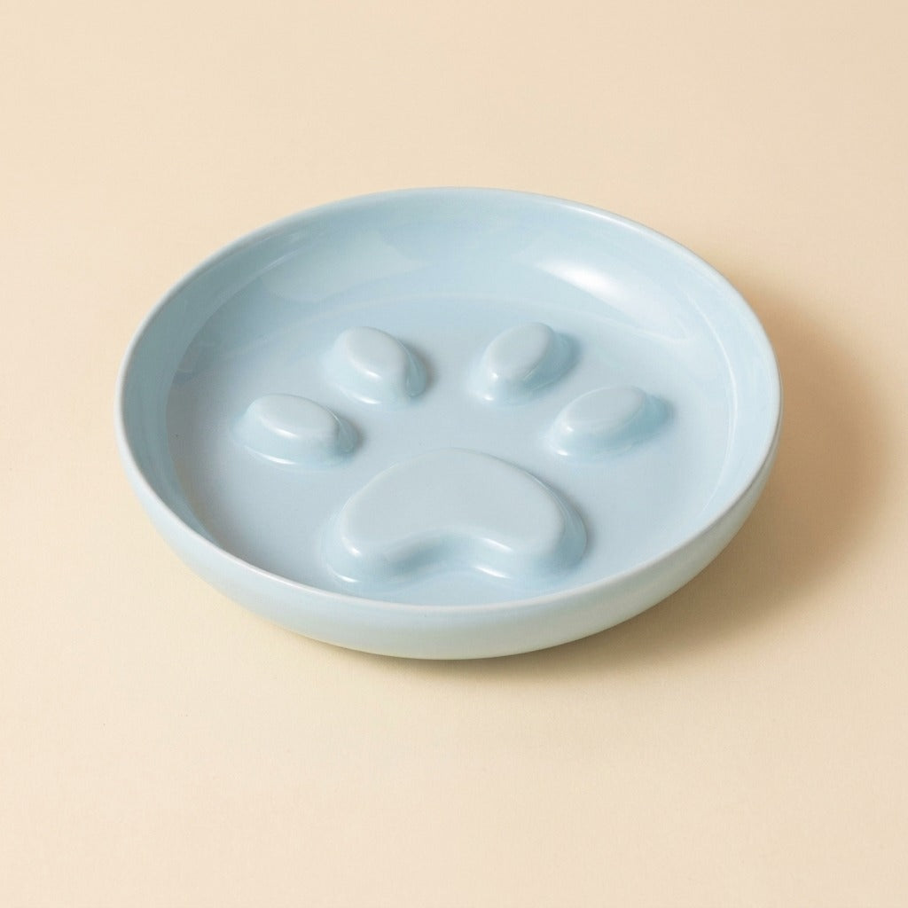 Paw Print Slow Feed Cat Plate in blue, plate only, studio shot