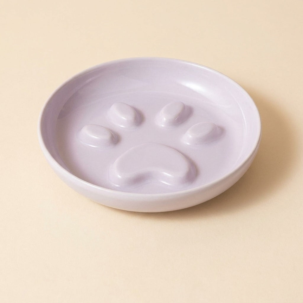 Paw Print Slow Feed Cat Plate in purple, plate only, studio shot