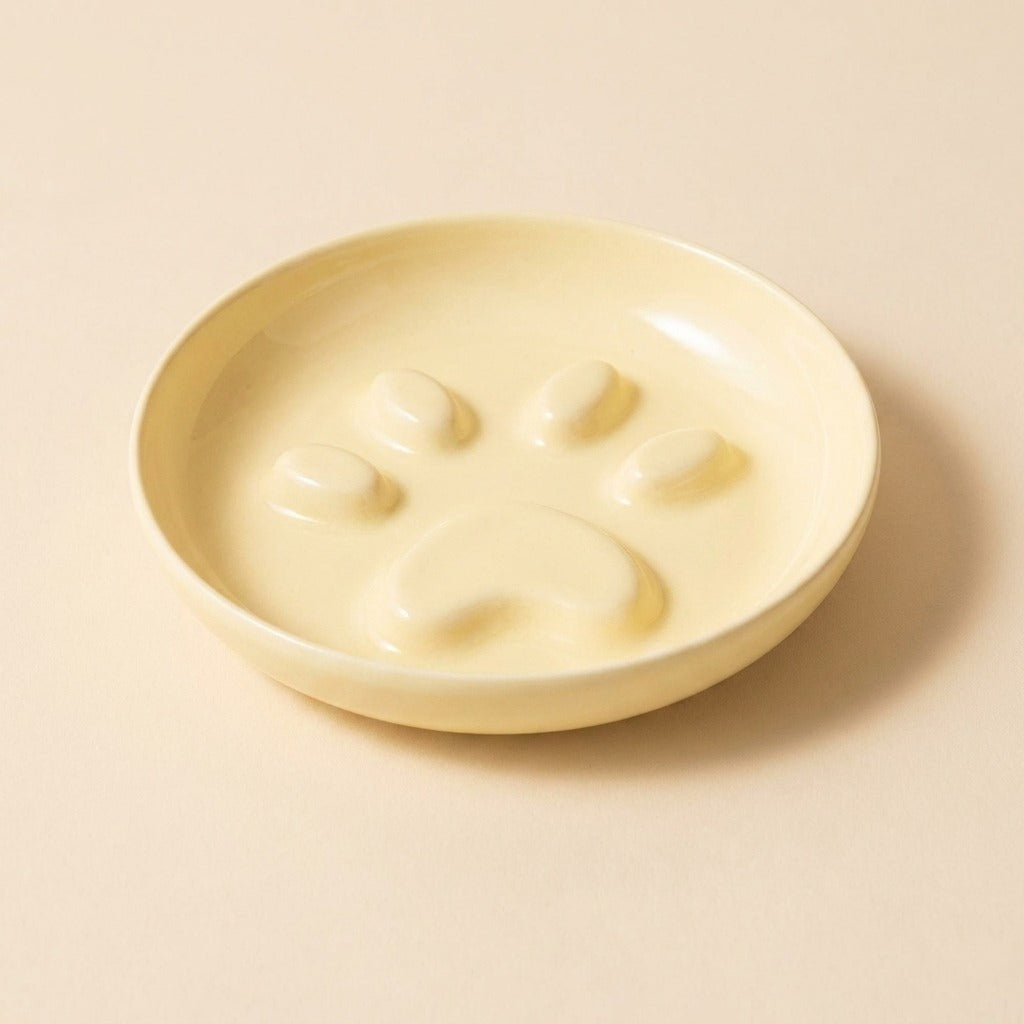 Paw Print Slow Feed Cat Plate in yellow, plate only, studio shot