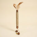 Silvervine chew stick with a feather and a small bell