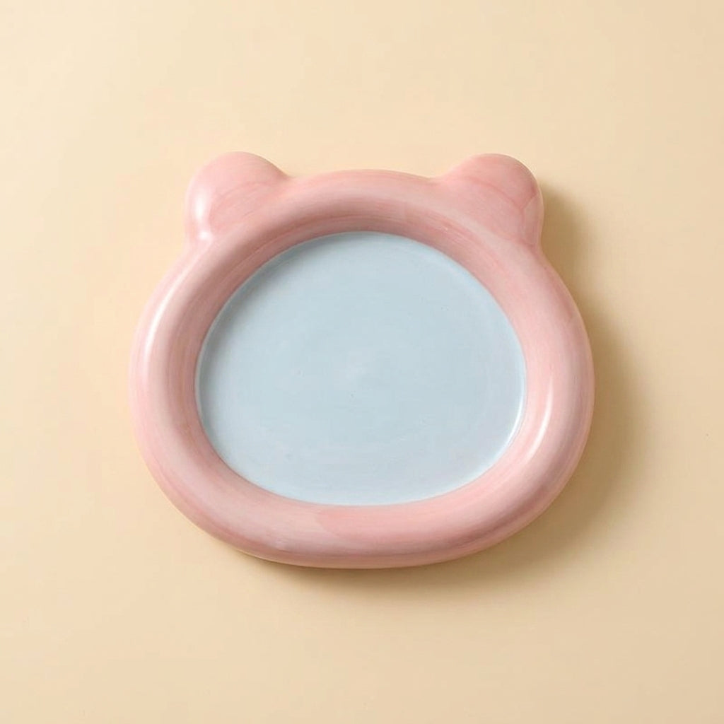 Pastel ceramic cat plate shaped like a bear head, pink rim with pale blue inner