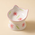 Cat Face Tilted Ceramic Bowl with painted flowers design, studio shot