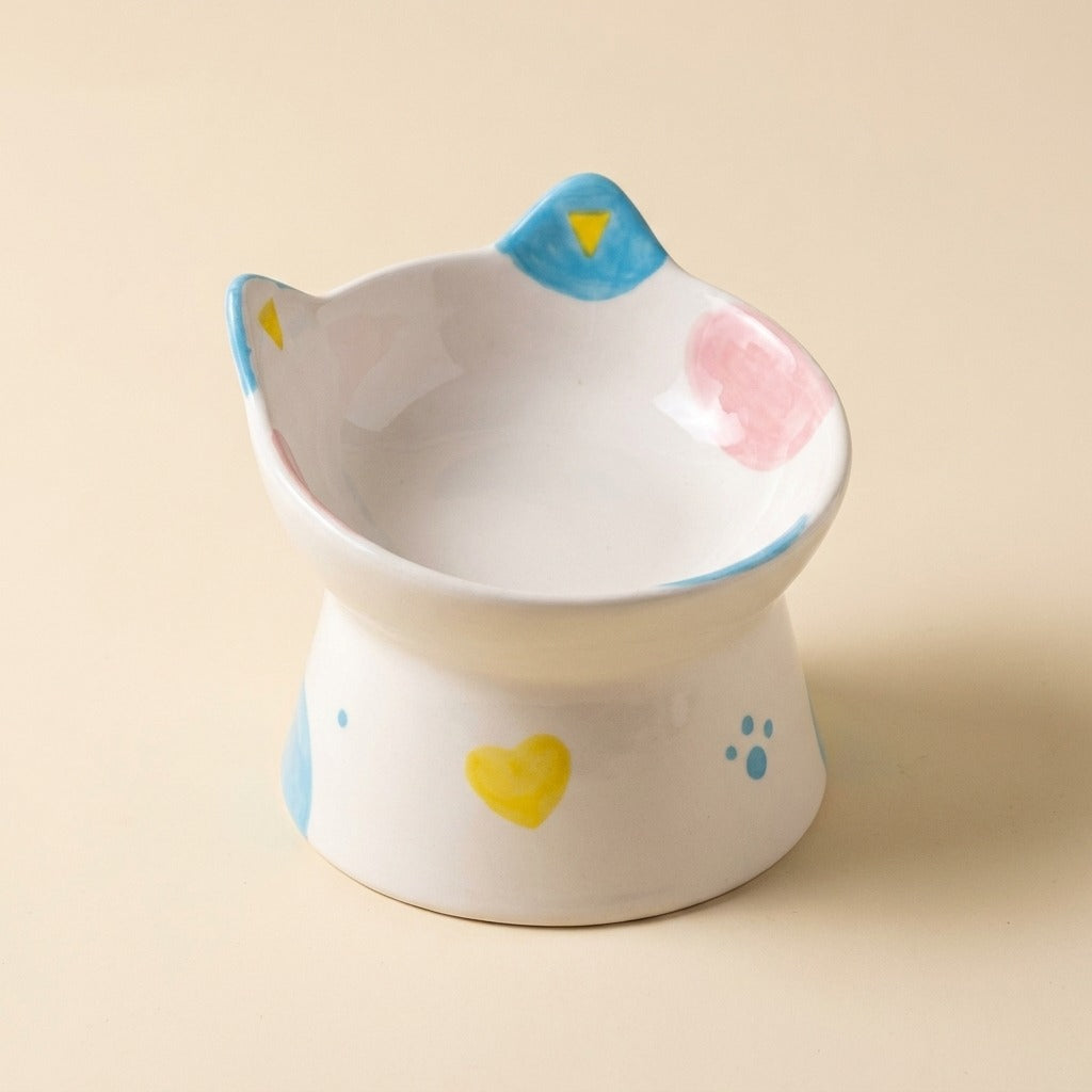 Cat Face Tilted Ceramic Bowl with painted spots design, studio shot