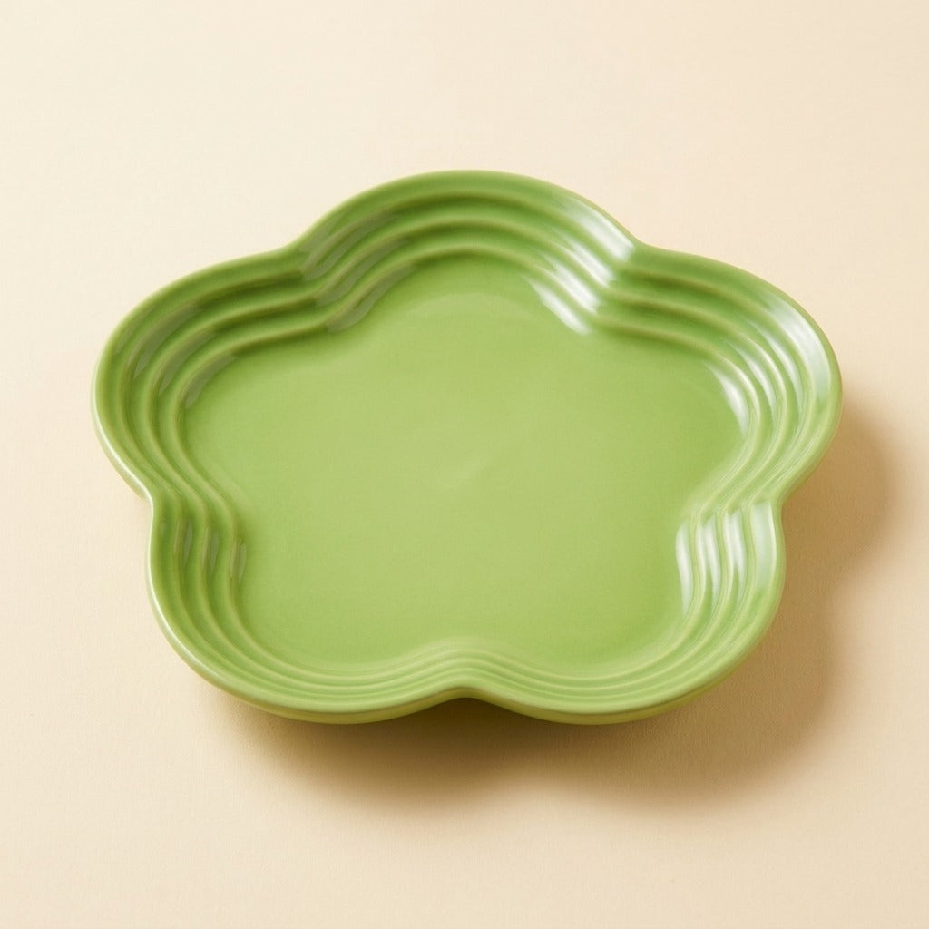 Extra Wide Whisker Relief Ceramic Cat Plate in apple green, flower shaped, studio shot