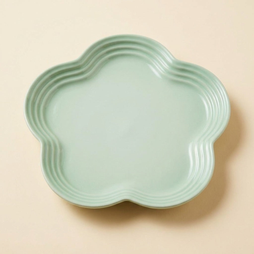 Extra Wide Whisker Relief Ceramic Cat Plate in mint green, flower shaped, studio shot