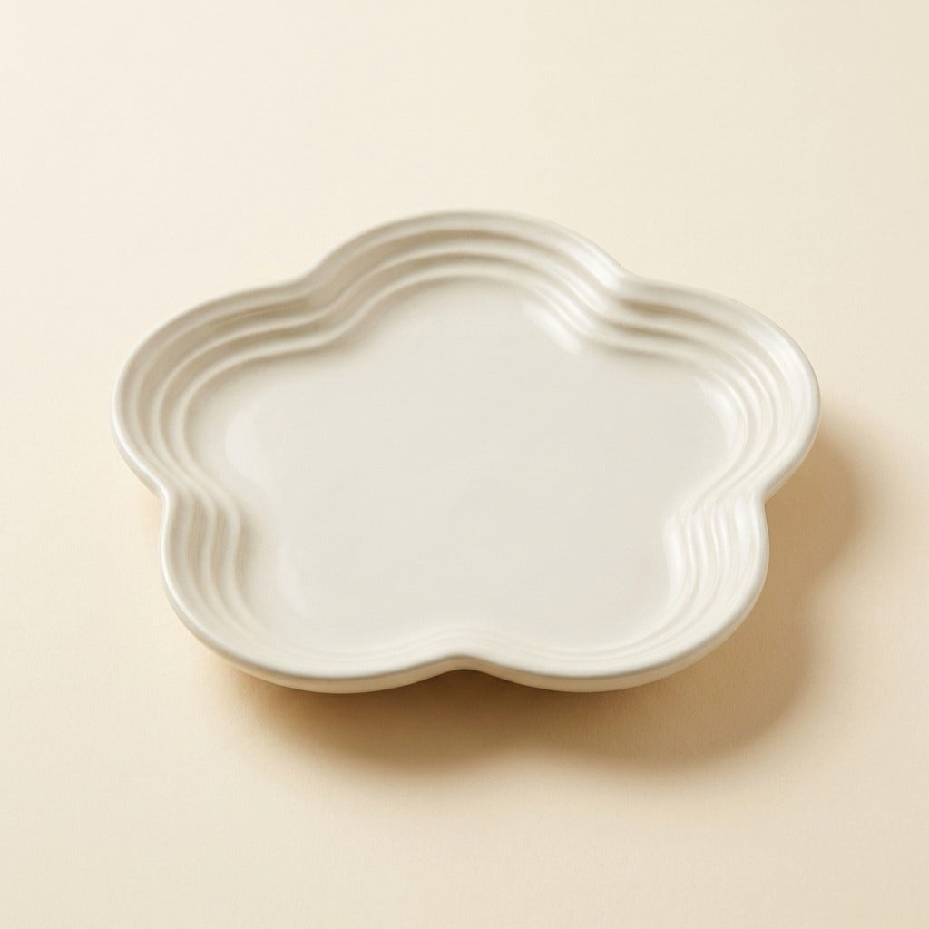 Extra Wide Whisker Relief Ceramic Cat Plate in warm milk white, flower shaped, studio shot