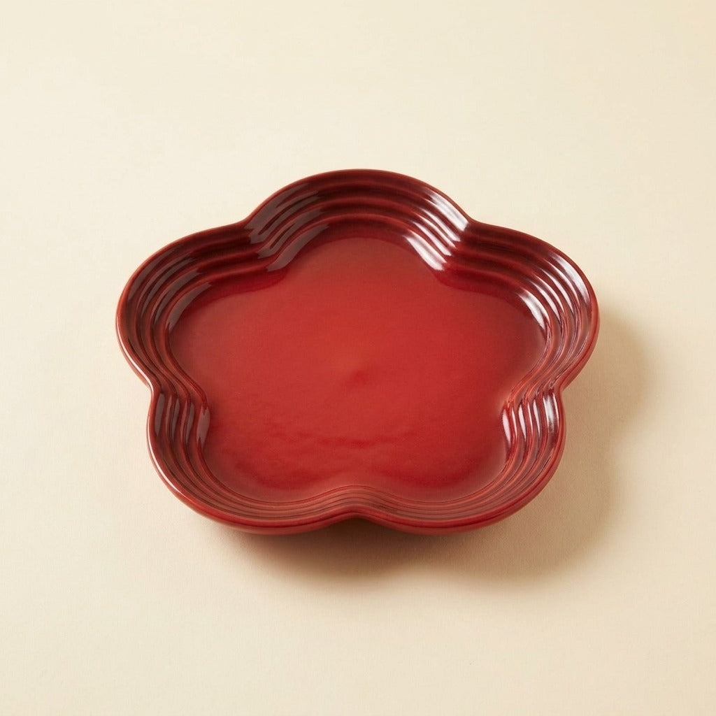 Extra Wide Whisker Relief Ceramic Cat Plate in deep red, flower shaped, studio shot