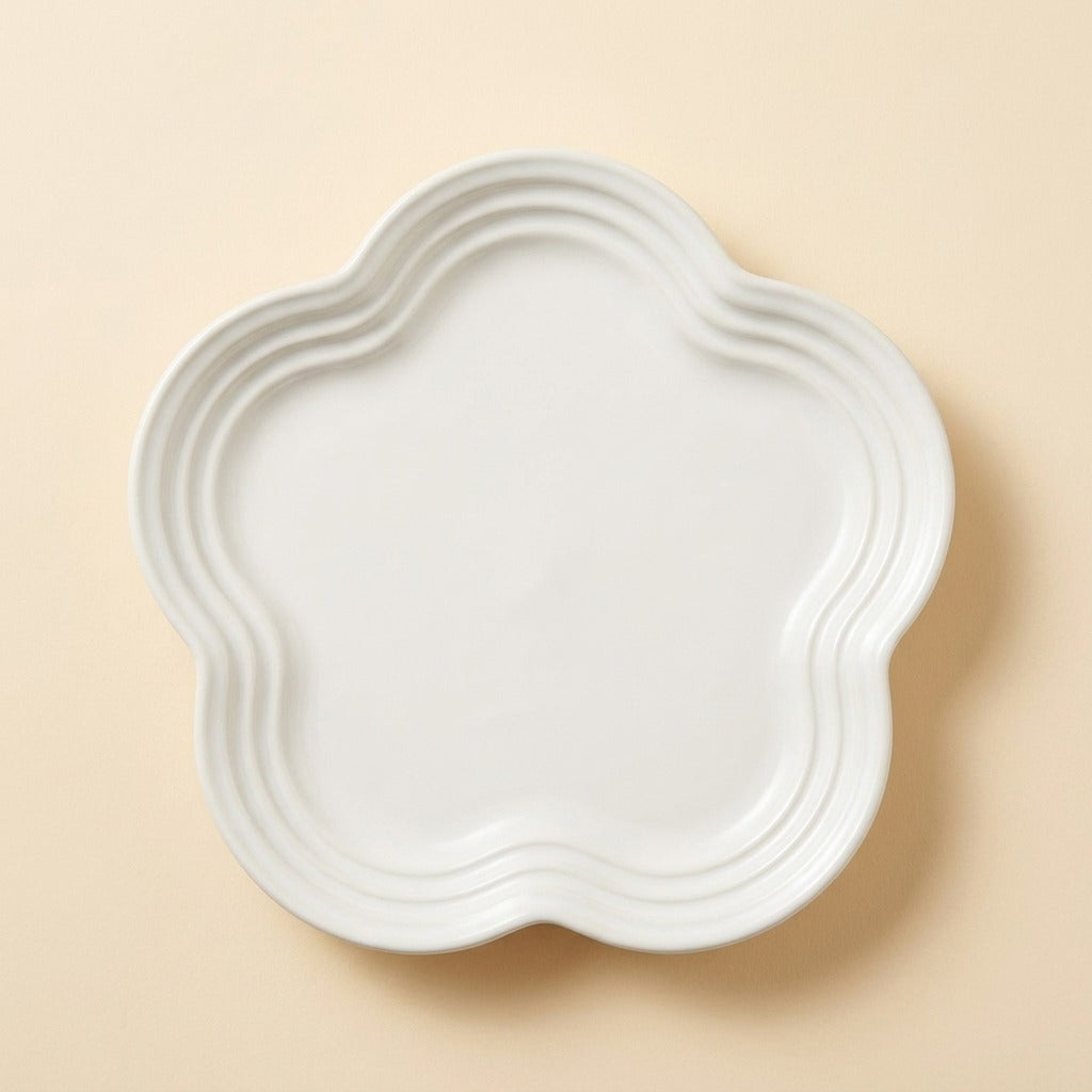 Extra Wide Whisker Relief Ceramic Cat Plate in glossy white, flower shaped, studio shot