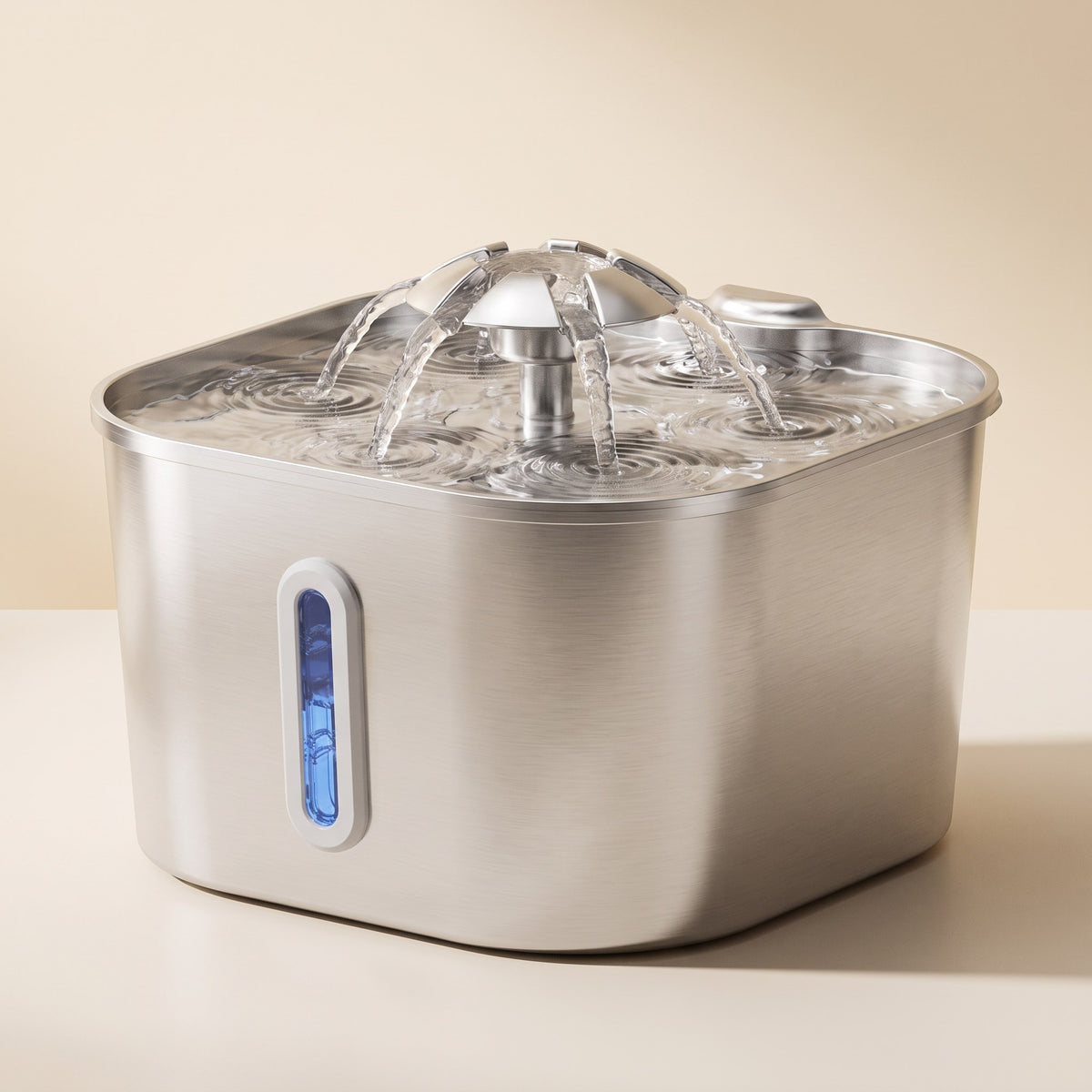 Compact 2.2L stainless steel cat water fountain with clear dome and water level window on a cream studio background