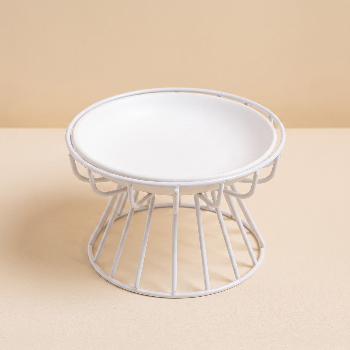 raised ceramic cat plate with wire stand, studio product photo