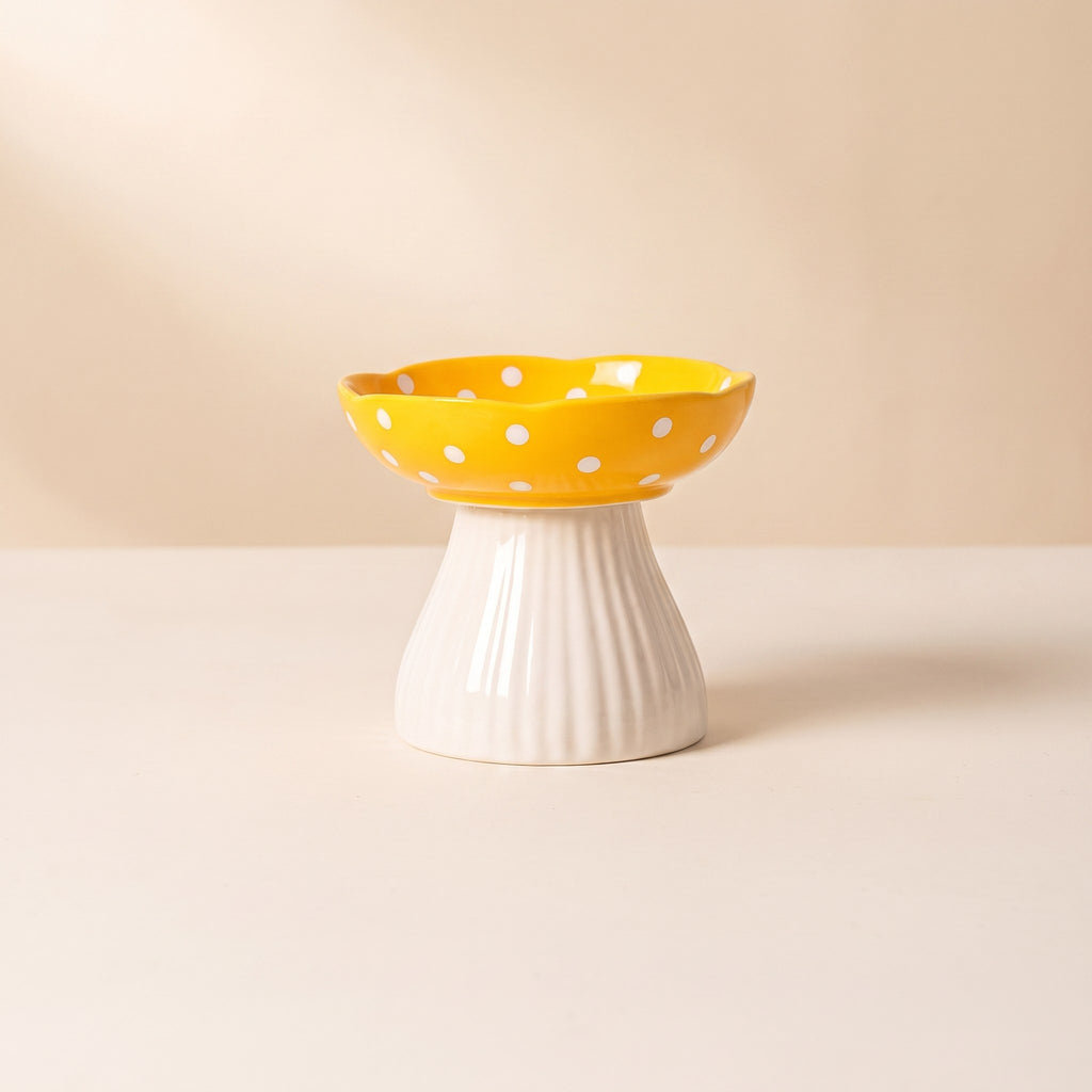 Mushroom Elevated Ceramic Cat Bowl with yellow polka dot cap on a cream studio background