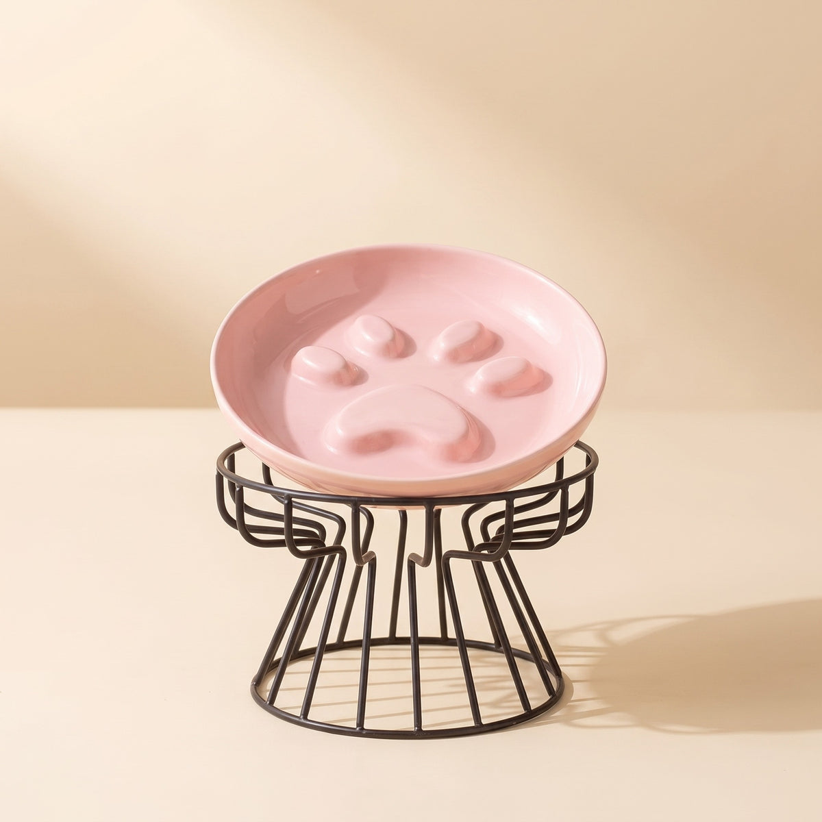 paw print slow feed cat plate on wire stand, studio product photo