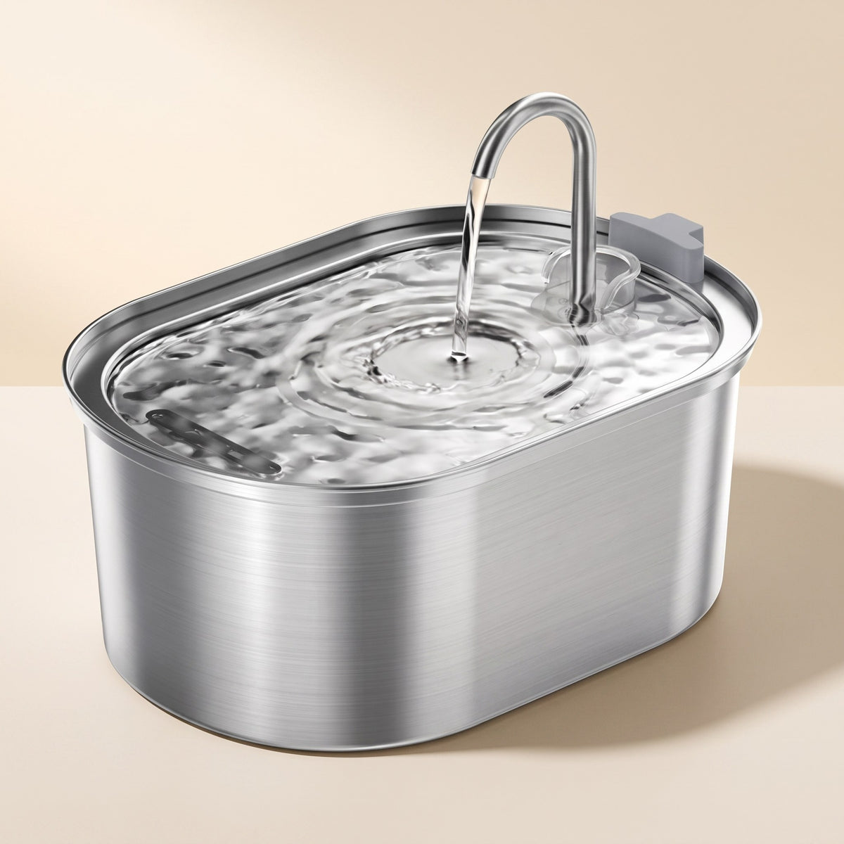 Smart Sensor Cat Water Fountain in stainless steel with running water on a cream studio background