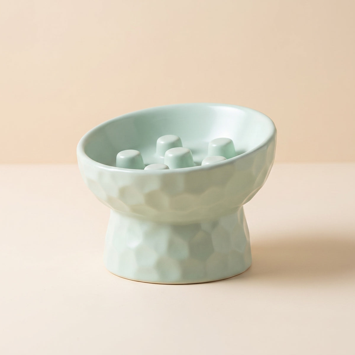 slanted ceramic slow feeder pedestal bowl, studio product photo